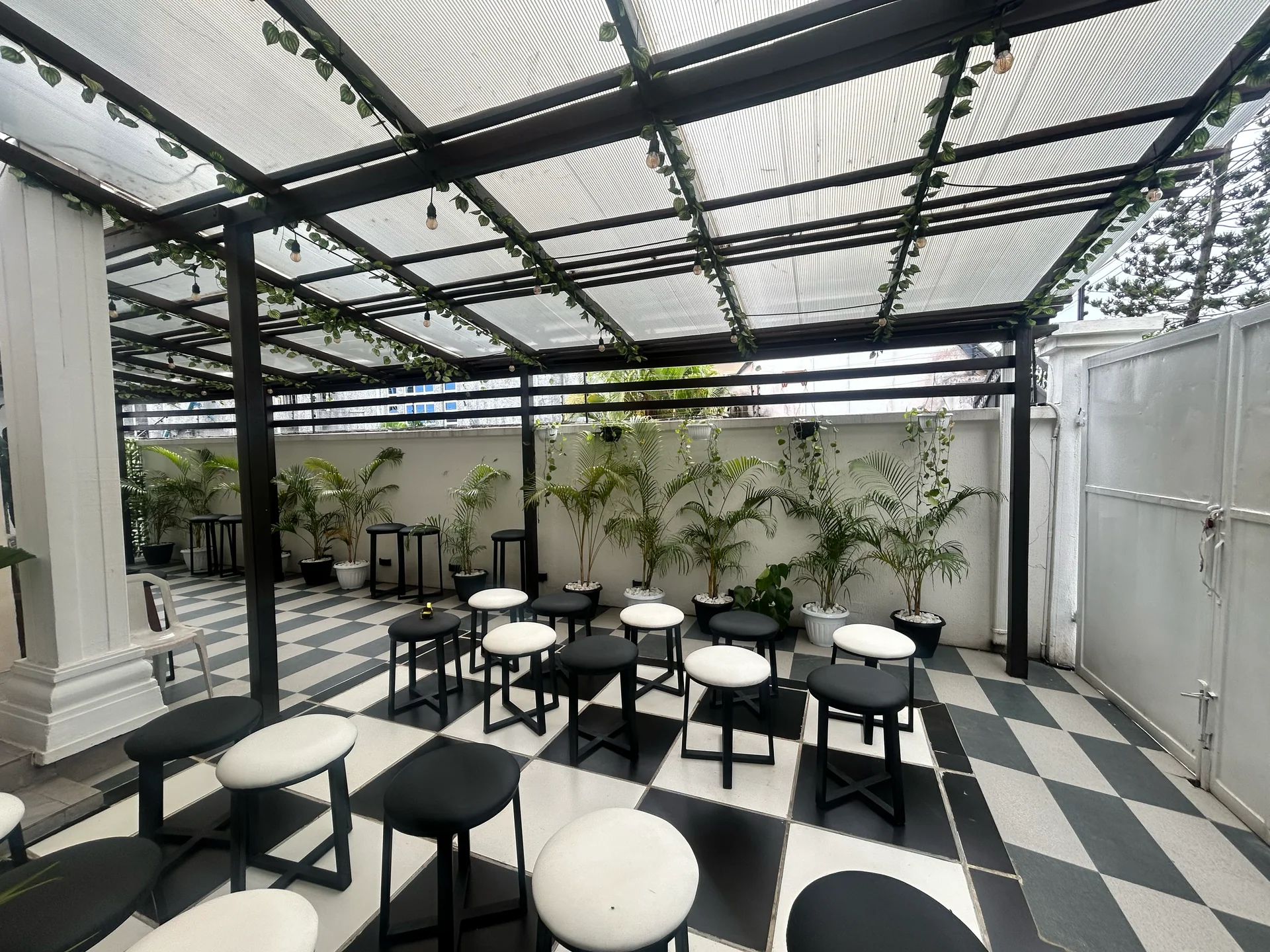 Covered courtyard and monochrome seating at ROJ